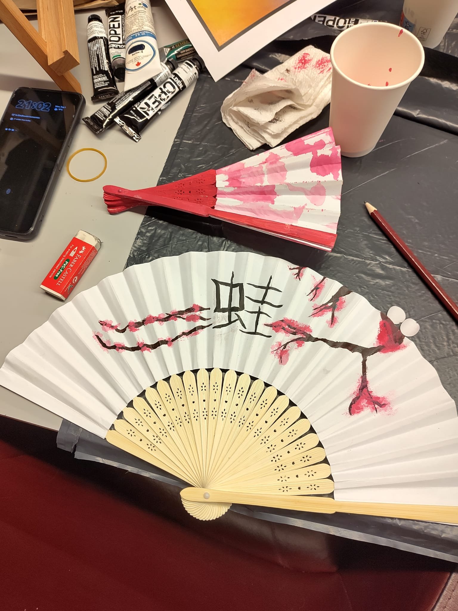 Painted paper hand fans