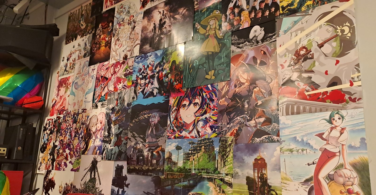 A wall full of posters related to Anime & Manga
